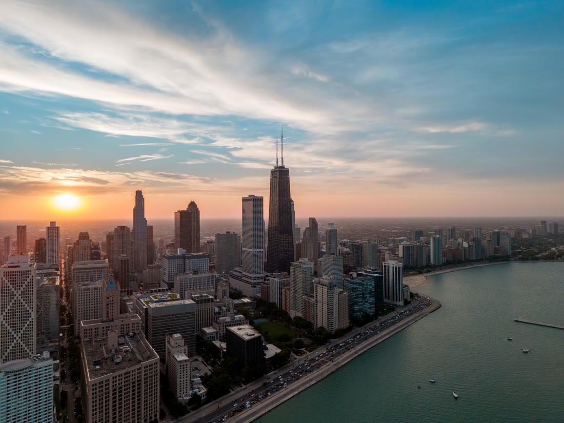 Aerial view of the Chicago skyline at sunset along Lake Michigan